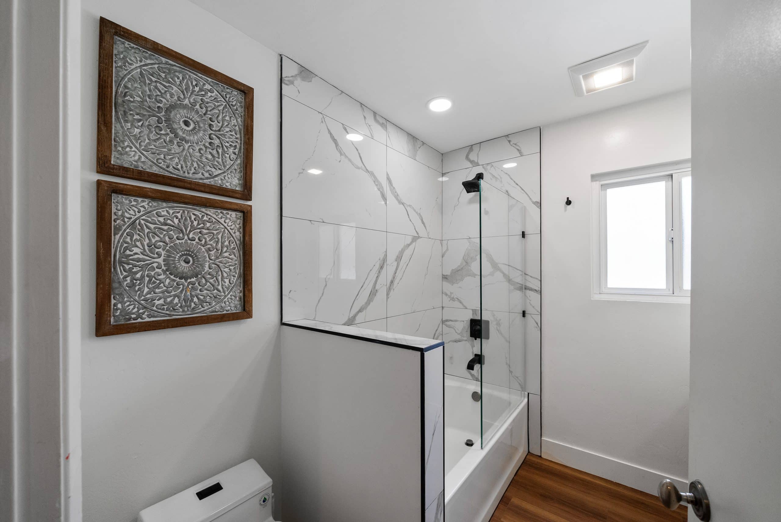 Marble walk-in shower with feature tile