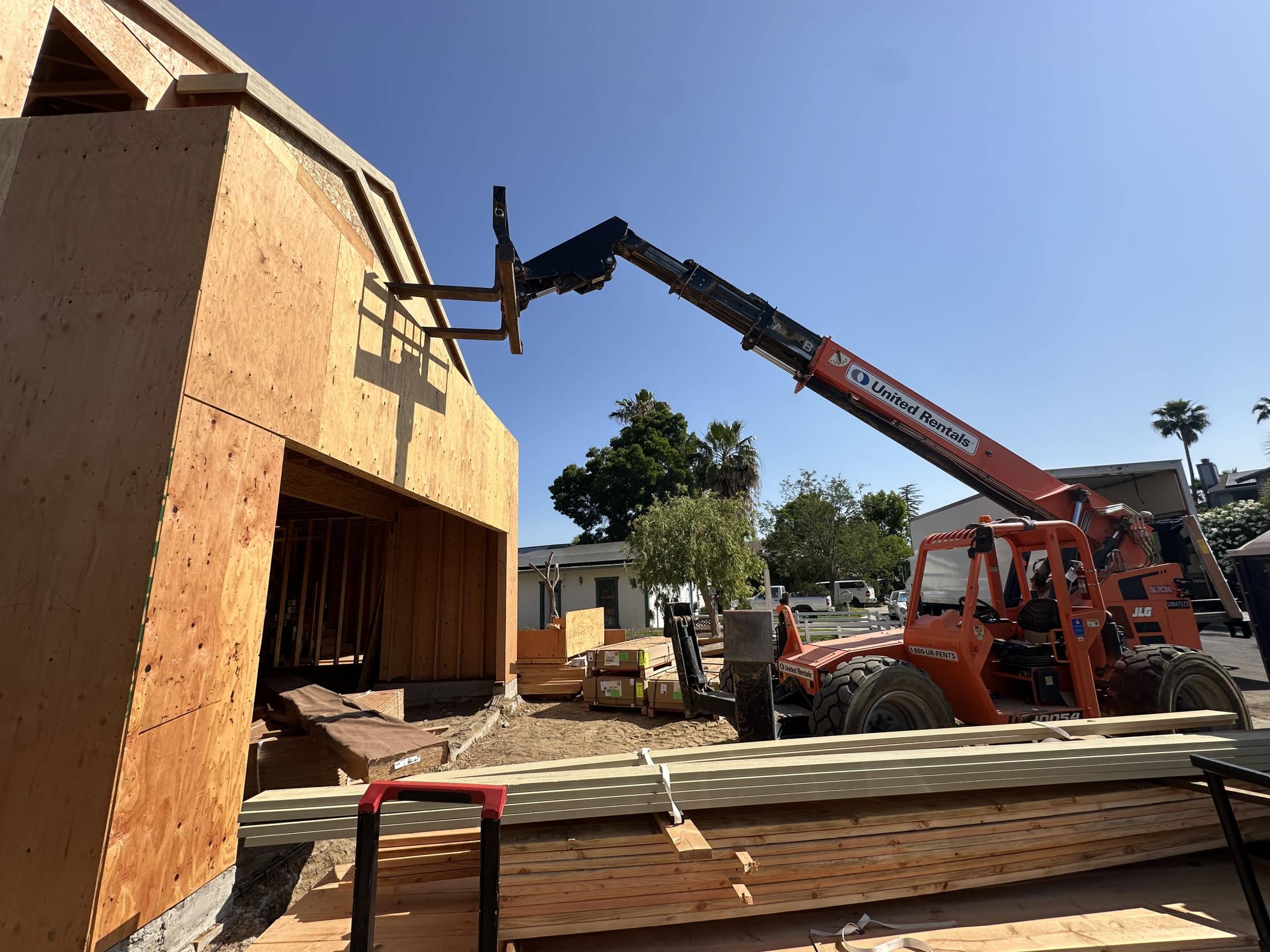 Custom home framing with crane on site, Lafayette
