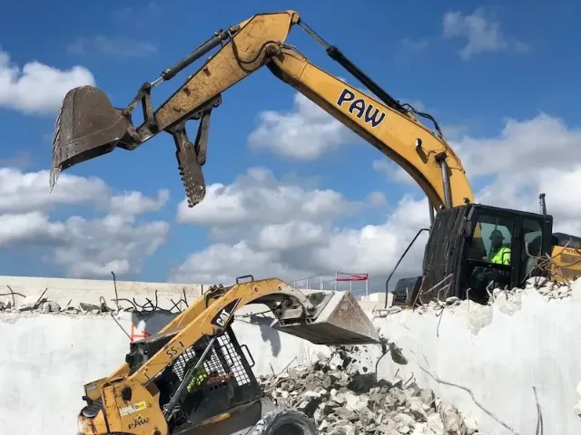 two demolition services cranes working on a new project