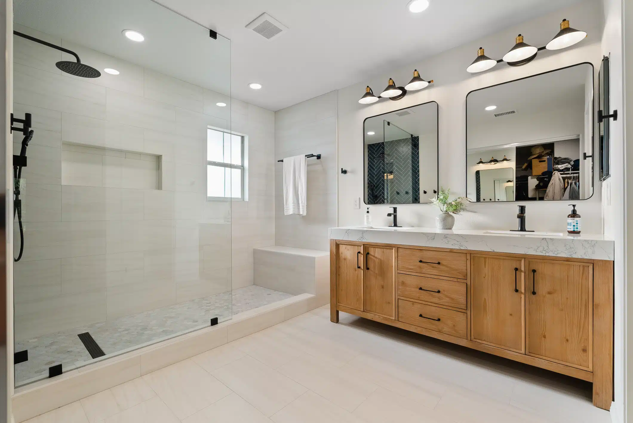 Moraga primary bath — double wood vanity, marble-look counters and large walk-in shower