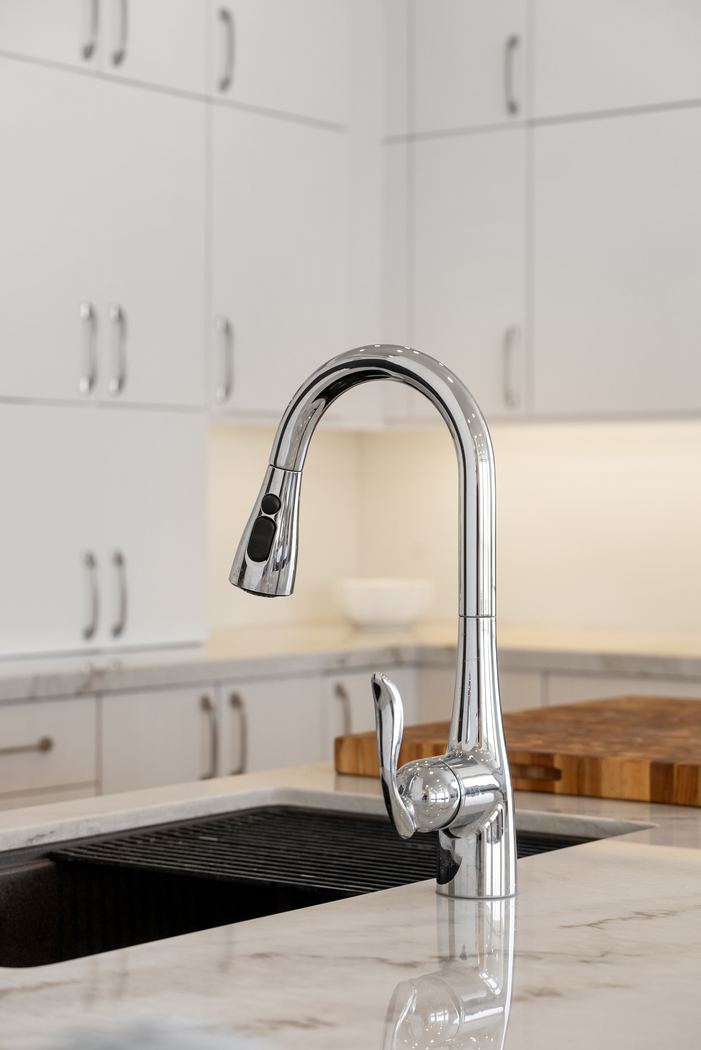 Lafayette kitchen remodel — polished fixtures and marble countertop detail