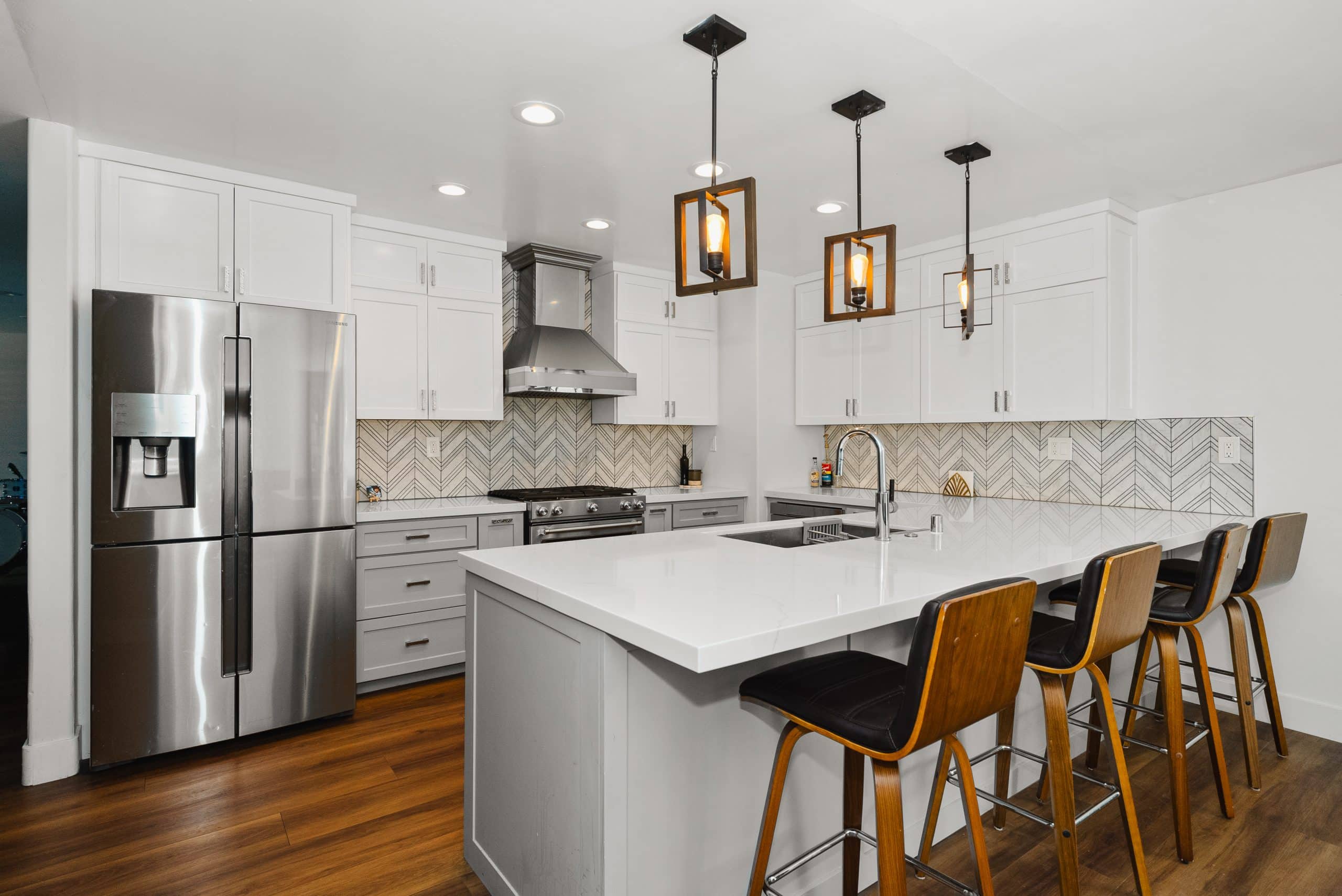 Discovery Bay full home remodel — white kitchen with chevron marble backsplash