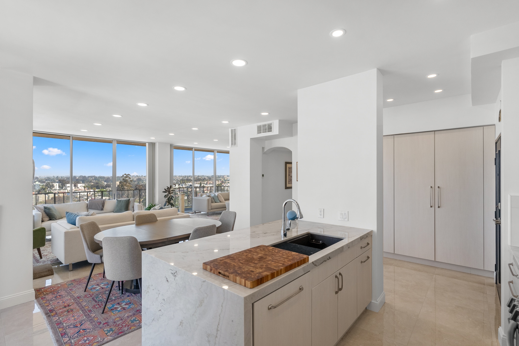 Full-home remodel in Lafayette, CA — open marble kitchen and view-forward living by Rhino Builders