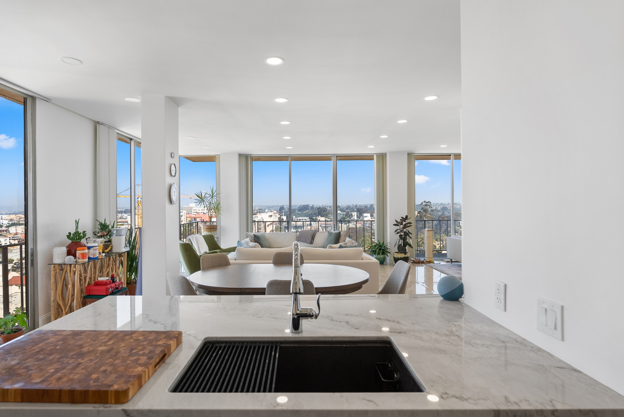 Lafayette remodel — open living and dining spaces framed by the window wall